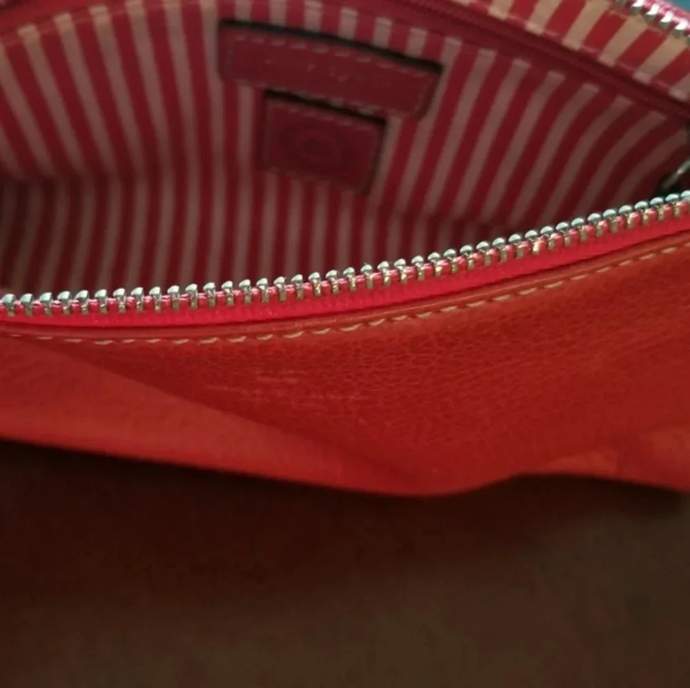 Kate Spade red pebbled leather wristlet bag